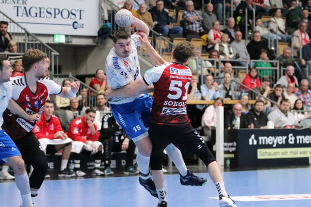25 02 2026 Handball Men 2025 2026 2 Handball Bundesliga 21 Matchday HSG Nordhorn Lingen Dessau Roßlauer HV 06 EmslandArena Lingen Marcel Nowak Dessau, 15, white in duel with Luka Sokolic Nordhorn, 51, red Lingen Ems Lower Saxony Germany