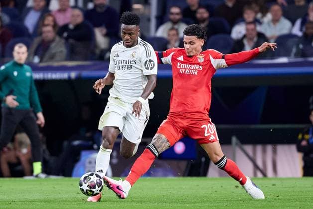 Vinicius Jr of Real Madrid CF and Richard Rios of Benfica Real Madrid v Benfica, UEFA Champions League, Play-off, Leg 2, Football, Estadio Bernabeu, Madrid, Spain - 25 Feb 2026Madrid Estadio Bernabeu Spain EDITORIAL USE ONLY No use with unauthorised audio, video, data, fixture lists, club league logos or live services. Online in-match use limited to 120 images, no video emulation. No use in betting, games or single club league player publications. Copyright: xRubenxAlbarran Shutterstockx 16703182ba