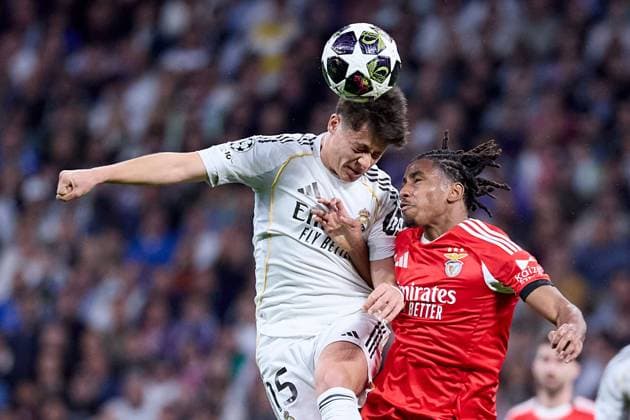 Arda Güler of Real Madrid CF and Leandro Barreiro of Benfica Real Madrid v Benfica, UEFA Champions League, Play-off, Leg 2, Football, Estadio Bernabeu, Madrid, Spain - 25 Feb 2026Madrid Estadio Bernabeu Spain EDITORIAL USE ONLY No use with unauthorised audio, video, data, fixture lists, club league logos or live services. Online in-match use limited to 120 images, no video emulation. No use in betting, games or single club league player publications. Copyright: xRubenxAlbarran Shutterstockx 16703182ar