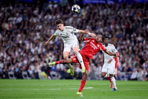 Arda Güler of Real Madrid CF and Leandro Barreiro of Benfica Real Madrid v Benfica, UEFA Champions League, Play-off, Leg 2, Football, Estadio Bernabeu, Madrid, Spain - 25 Feb 2026Madrid Estadio Bernabeu Spain EDITORIAL USE ONLY No use with unauthorised audio, video, data, fixture lists, club league logos or live services. Online in-match use limited to 120 images, no video emulation. No use in betting, games or single club league player publications. Copyright: xRubenxAlbarran Shutterstockx 16703182at