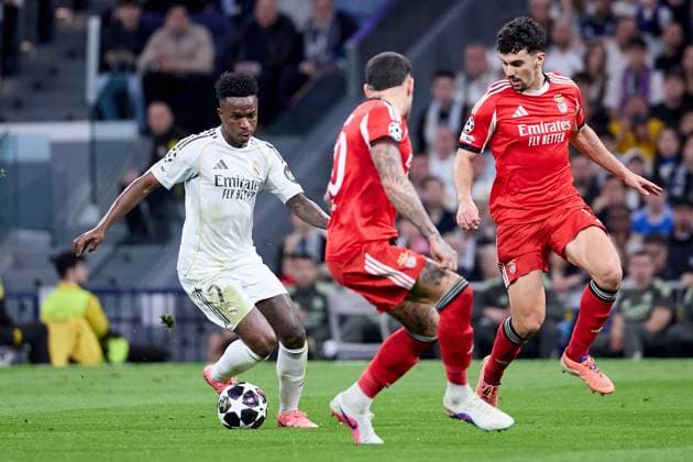 Vinicius Jr of Real Madrid CF and Tomas Araujo of Benfica Real Madrid v Benfica, UEFA Champions League, Play-off, Leg 2, Football, Estadio Bernabeu, Madrid, Spain - 25 Feb 2026Madrid Estadio Bernabeu Spain EDITORIAL USE ONLY No use with unauthorised audio, video, data, fixture lists, club league logos or live services. Online in-match use limited to 120 images, no video emulation. No use in betting, games or single club league player publications. Copyright: xRubenxAlbarran Shutterstockx 16703182aw