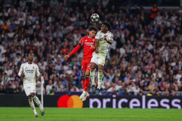 Madrid, Spain February 25, 2026 FBL UEFA Champions League 2025 26 Real Madrid SL Benfica Richard Rios S L Benfica , Aurelien Tchouameni Real Madrid battles for the Ball during the UEFA Champions League 2025 26 knockout play offs match between Real Madrid and SL Benfica at the Santiago BernabÃ u Stadium on February 25, 2026 in Madrid, Spain Copyright: JoaquimxFerreira