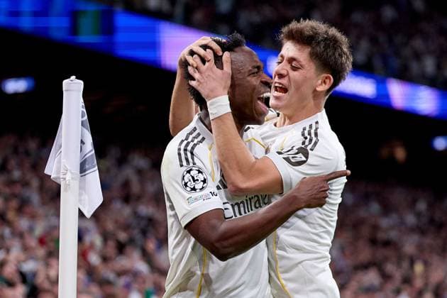 Vinicius Jr of Real Madrid CF celebrates after scoring a goal with Arda Güler of Real Madrid CF Real Madrid v Benfica, UEFA Champions League, Play-off, Leg 2, Football, Estadio Bernabeu, Madrid, Spain - 25 Feb 2026Madrid Estadio Bernabeu Spain EDITORIAL USE ONLY No use with unauthorised audio, video, data, fixture lists, club league logos or live services. Online in-match use limited to 120 images, no video emulation. No use in betting, games or single club league player publications. Copyright: xRubenxAlbarran Shutterstockx 16703182cn