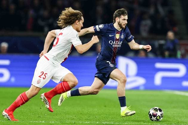 Paris Saint-Germain (PSG) v AS Monaco - UCL PARIS, FRANCE - FEBRUARY 25: Wout Faes of AS Monaco (L) and Khvicha Kvaratskhelia of Paris Saint-Germain (R) during the UEFA Champions League play-off second leg football match between Paris Saint-Germain (PSG) and AS Monaco at the Parc des Princes stadium in Paris. Ibrahim Ezzat Anadolu Paris France. Editorial use only. Please get in touch for any other usage.  Copyright: x2026xAnadoluxÄ°brahimxEzzatx