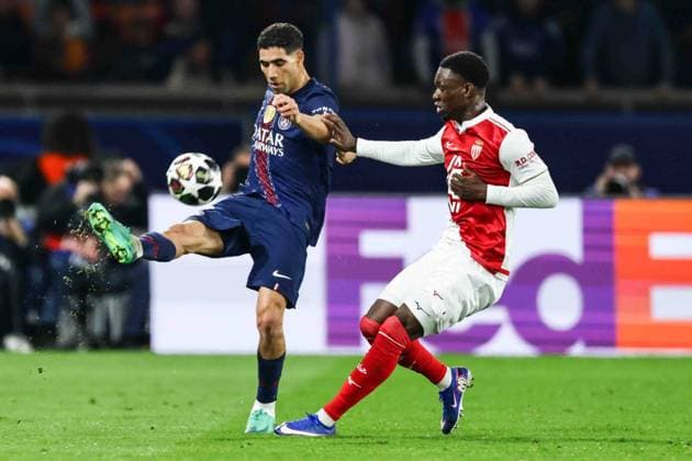 Paris Saint-Germain (PSG) v AS Monaco - UCL PARIS, FRANCE - FEBRUARY 25: Achraf Hakimi of Paris Saint-Germain (L) and Lamine Camara of AS Monaco during the UEFA Champions League play-off second leg football match between Paris Saint-Germain (PSG) and AS Monaco at the Parc des Princes stadium in Paris. Ibrahim Ezzat Anadolu Paris France. Editorial use only. Please get in touch for any other usage.  Copyright: x2026xAnadoluxÄ°brahimxEzzatx
