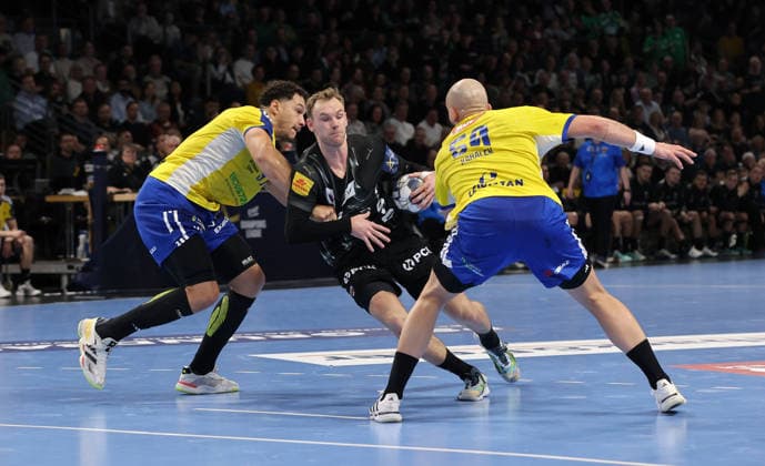 Theo Monar, Mathias Gidsel on the ball, Artsem Karalek duel Game scene Action Sport Handball CL Champions League Champions League Men Season 2025 2026 26 02 2026 Füchse Berlin vs KS Kielce in the Max Schmeling Halle