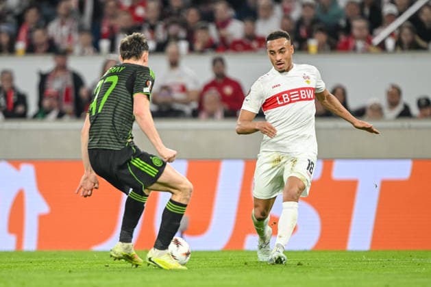 Dane Murray Celtic FC and Jamie Leweling VfB Stuttgart battle for the ball during the UEFA Europa League 2025 26 Knockout Play off Second Leg match between VfB Stuttgart and Celtic FC at Stuttgart Arena on February 26, 2026 in Stuttgart, Germany Photo by Harry Langer DeFodi Images