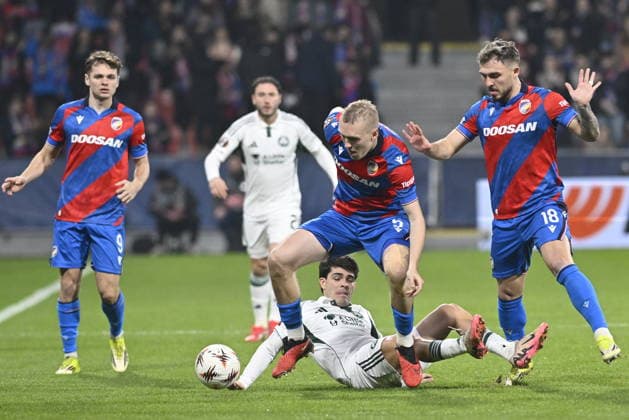 From left Denis Visinsky, Karel Spacil and Tomas Ladra of Plzen and on the ground Vicente Taborda of Panathinaikos during the European League playoffs return match of 1st round Viktoria Plzen vs Panathinaikos Athens on February 26, 2026 in Pilsen, Czech Republic. (CTKxPhoto MiroslavxChaloupka) CTKPhotoP2026022607438  CTKPhotoP2026022607438