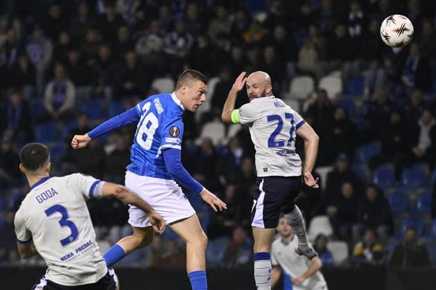 Genk s Daan Heymans and Dinamo s Josip Misic fight for the ball during a soccer game between Belgian team KRC Genk and Croatian GNK Dinamo Zagreb, Thursday 26 February 2026 in Genk, in the play-off for the knockout phase of the UEFA Europa League tournament. Genk won the first leg 1-3. JOHAN EYCKENS JohanxEyckens  x165467220x