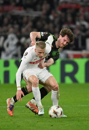 duel, action Chris Fuehrich VfB Stuttgart 10 vs Anthony Ralston Celtic Glasgow FC 56 in the background perimeter advertising logo FLIXTRAIN VfB Stuttgart vs Celtic Glasgow FC EUROPA LEAGUE EL 26 02 2026 DFL REGULATIONS PROHIBIT ANY USE OF PHOTOGRAPHS AS IMAGE SEQUENCES AND OR QUASI VIDEO VfB Stuttgart vs Celtic Glasgow FC EL