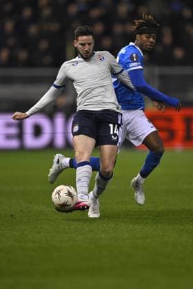 Dinamo s Marko Soldo and Genk s Noah Adedeji-Sternberg fight for the ball during a soccer game between Belgian team KRC Genk and Croatian GNK Dinamo Zagreb, Thursday 26 February 2026 in Genk, in the play-off for the knockout phase of the UEFA Europa League tournament. Genk won the first leg 1-3. JOHAN EYCKENS JohanxEyckens  x165496169x