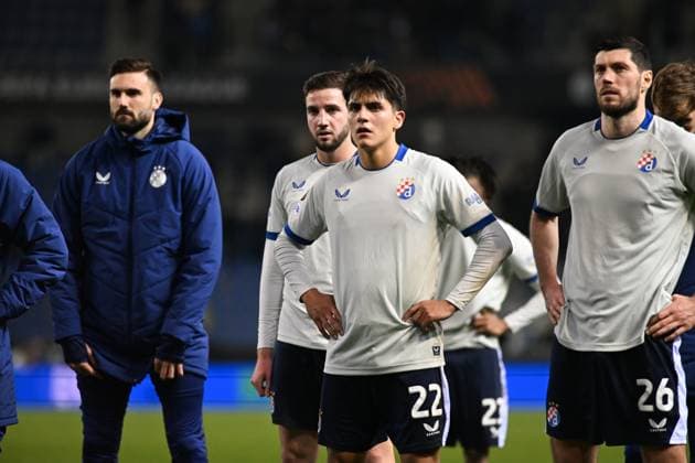 Dinamo s Matteo Perez Vinlof and Dinamo s Scott McKenna look dejected after a soccer game between Belgian team KRC Genk and Croatian GNK Dinamo Zagreb, Thursday 26 February 2026 in Genk, in the play-off for the knockout phase of the UEFA Europa League tournament. Genk won the first leg 1-3. JILLxDELSAUX  x165503905x