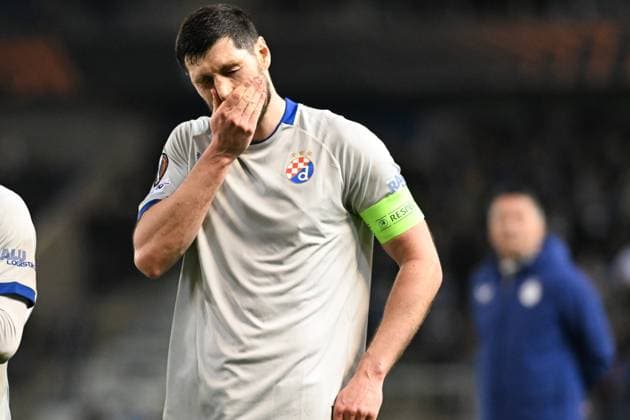 Dinamo s Scott McKenna looks dejected after a soccer game between Belgian team KRC Genk and Croatian GNK Dinamo Zagreb, Thursday 26 February 2026 in Genk, in the play-off for the knockout phase of the UEFA Europa League tournament. Genk won the first leg 1-3. JILLxDELSAUX  x165503976x