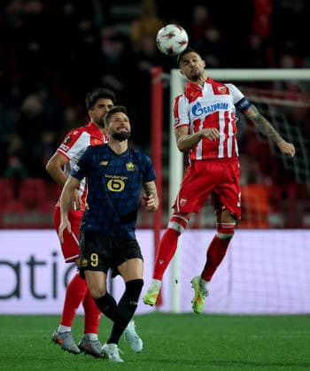 (260227) -- BELGRADE, Feb. 27, 2026 -- Crvena Zvezda s Rade Krunic (R) vies with Lille s Olivier Giroud (C) during the UEFA Europa League play-offs 2nd leg match between Crvena Zvezda and Lille in Belgrade, Serbia, on Feb. 26, 2026. (Photo by Xinhua) (SP)SERBIA-BELGRADE-FOOTBALL-UEFA EUROPA LEAGUE-CRVENA ZVEZDA VS LILLE PredragxMilosavljevic 