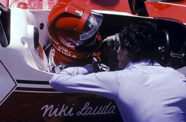 Niki Lauda (AUT) Ferrari 312T2, talking with Daniele Audetto (ITA) Ferrari Competition Manager, suffered a fiery accident on the second lap of the original race at Bergwerk which inflicted life-threatening burns...German Grand Prix, Rd 10, Nurburgring, 1 August 1976...BEST IMAGE Copyright: xSuttonxMotorsportsx