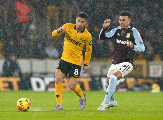 Wolverhampton, England, 27th February 2026. Joao Gomes of Wolverhampton Wanderers tussles with Morgan Rogers of Aston Villa during the Wolverhampton Wanderers vs Aston Villa Premier League match at Molineux, Wolverhampton. Picture credit should read: Andrew Yates Sportimage EDITORIAL USE ONLY. No use with unauthorised audio, video, data, fixture lists, club league logos or live services. Online in-match use limited to 120 images, no video emulation. No use in betting, games or single club league player publications. SPI_018_AY_Wolves_Villa SPI-4564-0018
