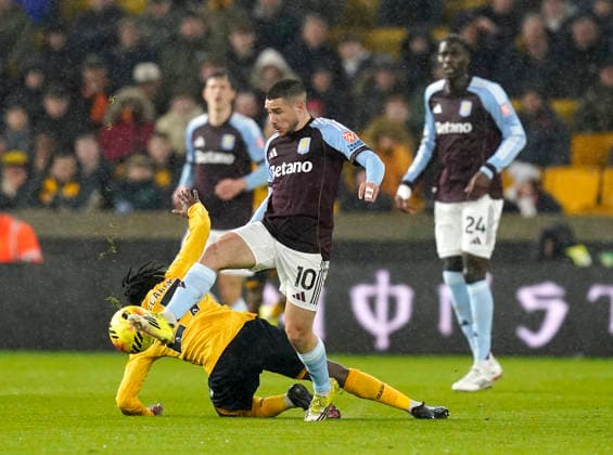 Wolverhampton, England, 27th February 2026. Emiliano Buendia of Aston Villa (r) tackles Jean-Ricner Bellegarde of Wolverhampton Wanderers during the Wolverhampton Wanderers vs Aston Villa Premier League match at Molineux, Wolverhampton. Picture credit should read: Andrew Yates Sportimage EDITORIAL USE ONLY. No use with unauthorised audio, video, data, fixture lists, club league logos or live services. Online in-match use limited to 120 images, no video emulation. No use in betting, games or single club league player publications. SPI_020_AY_Wolves_Villa SPI-4564-0020