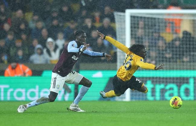 Mateus Mane of Wolverhampton Wanderers falls under pressure from Amadou Onana of Aston Villa Wolverhampton Wanderers v Aston Villa, Premier League, Football, Molineux, Wolverhampton, UK - 27 Feb 2026Wolverhampton Molineux United Kingdom EDITORIAL USE ONLY No use with unauthorised audio, video, data, fixture lists, club league logos or live services. Online in-match use limited to 120 images, no video emulation. No use in betting, games or single club league player publications. Copyright: xMichaelxZemanek Shutterstockx 16701657o
