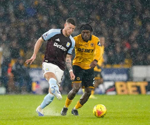 Wolverhampton, England, 27th February 2026. Ross Barkley of Aston Villa (l) and Jean-Ricner Bellegarde of Wolverhampton Wanderers (r) during the Wolverhampton Wanderers vs Aston Villa Premier League match at Molineux, Wolverhampton. Picture credit should read: Andrew Yates Sportimage EDITORIAL USE ONLY. No use with unauthorised audio, video, data, fixture lists, club league logos or live services. Online in-match use limited to 120 images, no video emulation. No use in betting, games or single club league player publications. SPI_038_AY_Wolves_Villa SPI-4564-0038