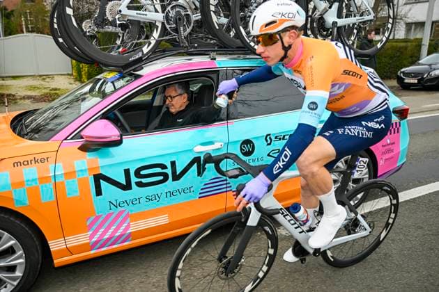 Omloop Het Nieuwsblad 2026 Cycling Race NINOVE, BELGIUM - FEBRUARY 28 : Askey Lewis (GBR) of NSN Cycling Team with the team car during the 81th edition of Omloop Het Nieuwsblad an UCI World Tour 1.UWT one day cycling road race for Men Elite of km with start in Ghent and finish in Ninove on February 28, 2026 in Ninove, Belgium, 28 02 2026 ( Motordriver Kenny Verfaillie - Ninove Belgium  Copyright: xNicoxVereeckenx