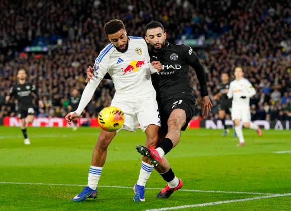 Leeds, England, 28th February 2026. Jayden Bogle of Leeds United and Rayan Alt-Nouri of Manchester City during the Leeds United vs Manchester City Premier League match at Elland Road, Leeds. Picture credit should read: Andrew Yates Sportimage EDITORIAL USE ONLY. No use with unauthorised audio, video, data, fixture lists, club league logos or live services. Online in-match use limited to 120 images, no video emulation. No use in betting, games or single club league player publications. SPI_053_AY_Leeds_Man_City SPI-4565-0053