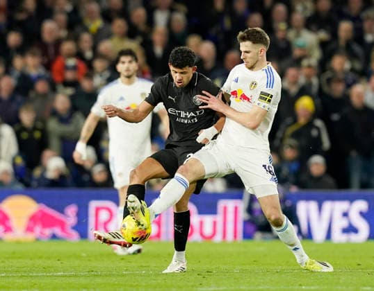 Leeds, England, 28th February 2026. Matheus Nunes of Manchester City tackled by Anton Stach of Leeds United during the Leeds United vs Manchester City Premier League match at Elland Road, Leeds. Picture credit should read: Andrew Yates Sportimage EDITORIAL USE ONLY. No use with unauthorised audio, video, data, fixture lists, club league logos or live services. Online in-match use limited to 120 images, no video emulation. No use in betting, games or single club league player publications. SPI_054_AY_Leeds_Man_City SPI-4565-0054