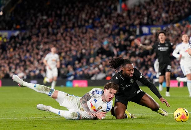 Leeds, England, 28th February 2026. Joe Rodon of Leeds United tussles with Antoine Semenyo of Manchester City during the Leeds United vs Manchester City Premier League match at Elland Road, Leeds. Picture credit should read: Andrew Yates Sportimage EDITORIAL USE ONLY. No use with unauthorised audio, video, data, fixture lists, club league logos or live services. Online in-match use limited to 120 images, no video emulation. No use in betting, games or single club league player publications. SPI_068_AY_Leeds_Man_City SPI-4565-0068