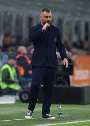 Milan, Italy, 28th February 2026. Daniele De Rossi Head coach of Genoa CFC reacts during the Internazionale vs Genoa Serie A match at Giuseppe Meazza, Milan. Picture credit should read: Jonathan Moscrop Sportimage EDITORIAL USE ONLY. No use with unauthorised audio, video, data, fixture lists, club league logos or live services. Online in-match use limited to 120 images, no video emulation. No use in betting, games or single club league player publications. SPI_014_INTER_GENOA_ SPI-4553-0014