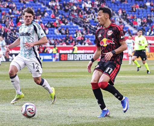 February 28, 2026, Harrison, New Jersey, USA: New England Revolution defender Ilay Feingold (12) and New York Red Bulls forward Jorge Ruvalcaba (11) battle for the ball at Sports Illustrated Stadium. Harrison USA - ZUMAs325 20260228_zsp_s325_062 Copyright: xJessxStilesx
