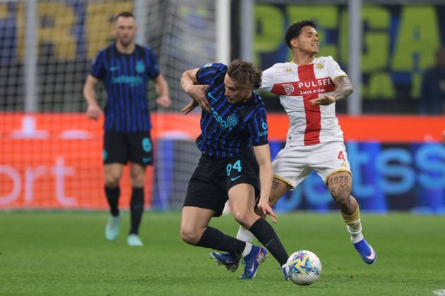 Milan, Italy, 28th February 2026. Francesco Pio Esposito of FC Internazionale challenges Alexandro Amorim De Freitas of Genoa CFC during the Internazionale vs Genoa Serie A match at Giuseppe Meazza, Milan. Picture credit should read: Jonathan Moscrop Sportimage EDITORIAL USE ONLY. No use with unauthorised audio, video, data, fixture lists, club league logos or live services. Online in-match use limited to 120 images, no video emulation. No use in betting, games or single club league player publications. SPI_034_INTER_GENOA_ SPI-4553-0034