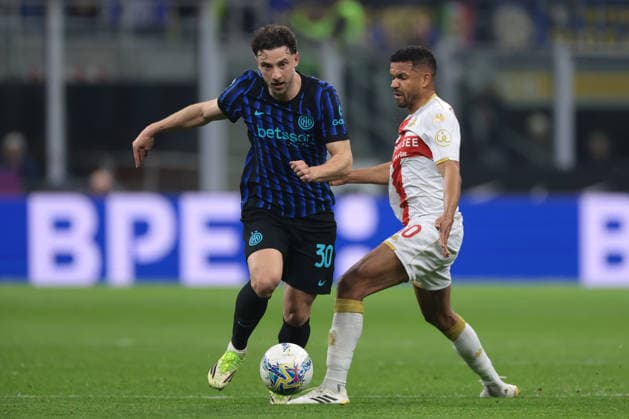Milan, Italy, 28th February 2026. Junior Messias of Genoa CFC challenges Carlos Augusto of FC Internazionale during the Internazionale vs Genoa Serie A match at Giuseppe Meazza, Milan. Picture credit should read: Jonathan Moscrop Sportimage EDITORIAL USE ONLY. No use with unauthorised audio, video, data, fixture lists, club league logos or live services. Online in-match use limited to 120 images, no video emulation. No use in betting, games or single club league player publications. SPI_045_INTER_GENOA_ SPI-4553-0045