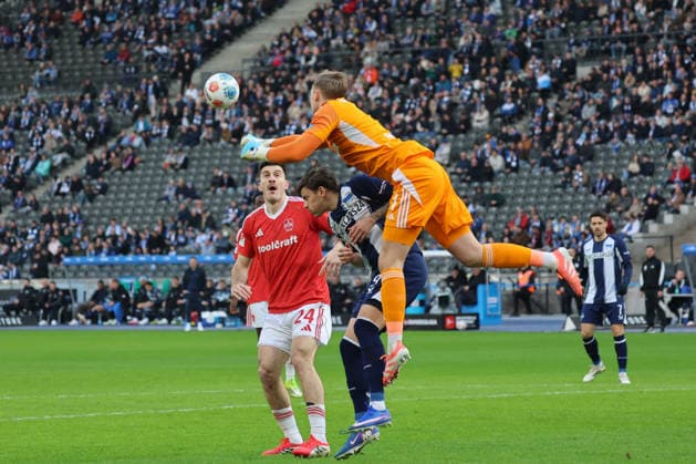 BERLIN, GERMANY - MARCH 1: Torwart Goal Keeper Jan Reichert (Nürnberg, 1) saves the ball from Dawid Kownacki (Hertha, 9), on the left side Luka Lochoshvili (Nürnberg, 24), during the Bundesliga match between Hertha BSC - 1. FC Nürnberg at Olympiastadion on matchday 24 of the 2. Bundesliga on March 1, 2026 in Berlin, Germany. DFL REGULATIONS PROHIBIT ANY USE OF PHOTOGRAPHS AS IMAGE SEQUENCES AND OR QUASI-VIDEO. Berlin Germany Copyright: xO.Frankex