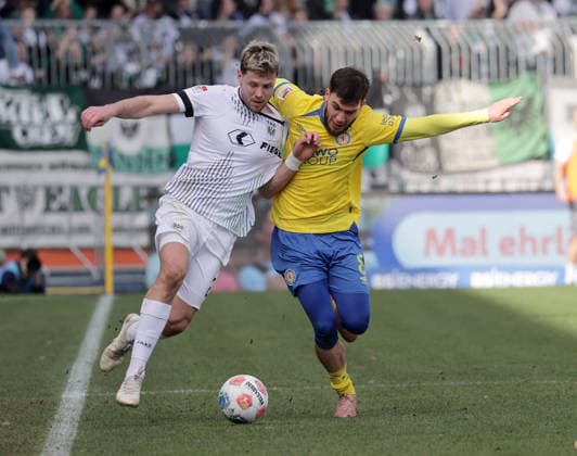 Duel between Imad Rondic SC Preussen Muenster and Mehmet Aydin Eintracht Braunschweig Football, Men, Season 2025 2026 2 BL, Eintracht Stadion, Eintracht Braunschweig vs SC Preussen Muenster DFL REGULATIONS PROHIBIT ANY USE OF PHOTOGRAPHS AS IMAGE SEQUENCES AND OR QUASI VIDEO