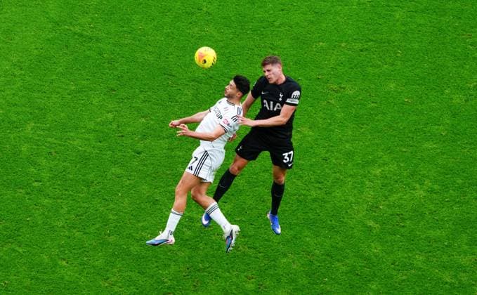 Raul Jimenez of Fulham battles with Micky van de Ven of Tottenham Hotspur Fulham v Tottenham Hotspur, Premier League, Football, Craven Cottage, London, UK - 01 Mar 2026London Craven Cottage United Kingdom EDITORIAL USE ONLY No use with unauthorised audio, video, data, fixture lists, club league logos or live services. Online in-match use limited to 120 images, no video emulation. No use in betting, games or single club league player publications. Copyright: xJavierxGarcia Shutterstockx 16708826ae