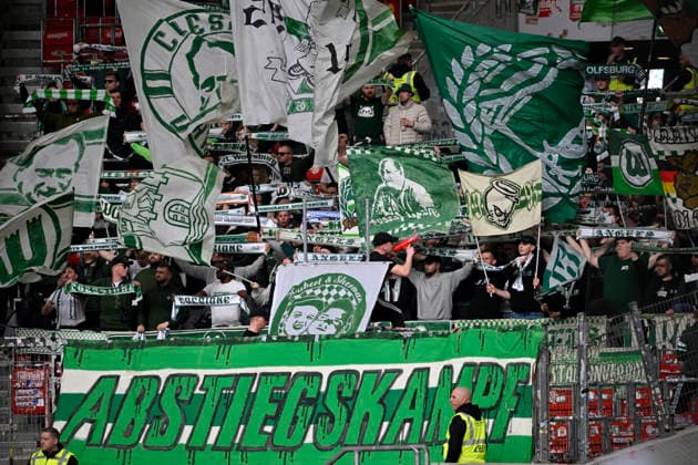 Fan block, fans, fan curve, flags, flags, atmosphere, atmospheric VfL Wolfsburg VfB Stuttgart vs VfL Wolfsburg WOB 01 03 2026 DFL REGULATES PROHIBIT ANY USE OF PHOTOGRAPHS AS IMAGE SEQUENCES AND OR QUASI VIDEO VfB Stuttgart vs VfL Wolfsburg WOB