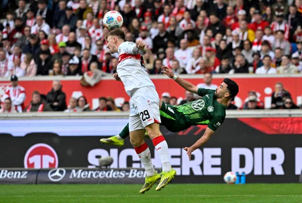 duel, action Mohamed Amoura VfL Wolfsburg 09 Fallrueckzieher against Finn Jeltsch VfB Stuttgart 29 VfB Stuttgart vs VfL Wolfsburg WOB 01 03 2026 DFL REGULATIONS PROHIBIT ANY USE OF PHOTOGRAPHS AS IMAGE SEQUENCES AND OR QUASI VIDEO VfB Stuttgart vs VfL Wolfsburg WOB