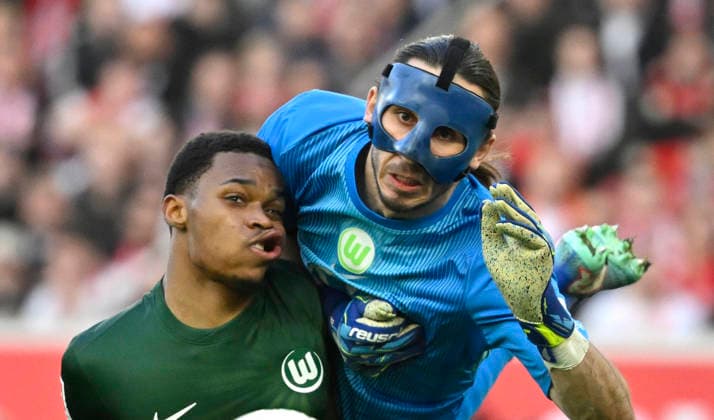Collision injured Injury Goalkeeper Kamil Grabara VfL Wolfsburg 01 vs Jeanuel Belocian VfL Wolfsburg 06 VfB Stuttgart vs VfL Wolfsburg WOB 01 03 2026 DFL REGULATIONS PROHIBIT ANY USE OF PHOTOGRAPHS AS IMAGE SEQUENCES AND OR QUASI VIDEO VfB Stuttgart vs VfL Wolfsburg WOB