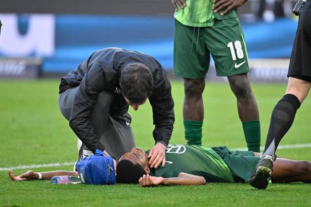 after collision injured injury goalkeeper Kamil Grabara VfL Wolfsburg 01 against Jeanuel Belocian VfL Wolfsburg 06 on the ground supervisor VfB Stuttgart vs VfL Wolfsburg WOB 01 03 2026 DFL REGULATIONS PROHIBIT ANY USE OF PHOTOGRAPHS AS IMAGE SEQUENCES AND OR QUASI VIDEO VfB Stuttgart vs VfL Wolfsburg WOB