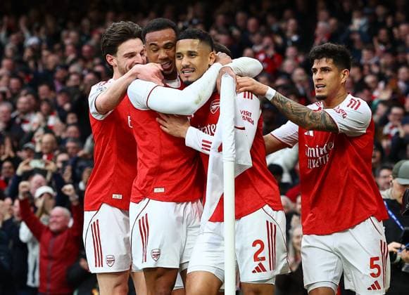 William Saliba of Arsenal celebrates scoring the opening goal with team-mates Arsenal v Chelsea, Premier League, Football, Emirates Stadium, London, UK - 01 Mar 2026London Emirates Stadium United Kingdom EDITORIAL USE ONLY No use with unauthorised audio, video, data, fixture lists, club league logos or live services. Online in-match use limited to 120 images, no video emulation. No use in betting, games or single club league player publications. Copyright: xMichaelxZemanek Shutterstockx 16708844w
