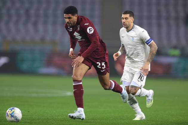 Turin, Italy, 1st March 2026. Saul Coco of Torino FC. is pursued by Mattia Zaccagni of SS Lazio during the Torino vs SS Lazio Serie A match at Stadio Grande Torino, Turin. Picture credit should read: Jonathan Moscrop Sportimage EDITORIAL USE ONLY. No use with unauthorised audio, video, data, fixture lists, club league logos or live services. Online in-match use limited to 120 images, no video emulation. No use in betting, games or single club league player publications. SPI_004_TORO_LAZIO SPI-4554-0004