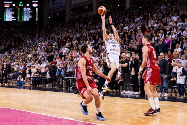 BONN, GERMANY - MARCH 01: David Kraemer (Germany, 44) shoots the ball, stepback over Roko Badzim (Croatia, 18) and Mario Hezonja (Croatia, 8) during the FIBA World Cup Qualifier match between Germany vs. Croatia at Telekom Dome Bonn on the first round of group E of the FIBA World Cup Qualifiers on March 01, 2026 in Bonn, Germany. North Rhine Westphalia Germany Copyright: xSteffiexWunderlx