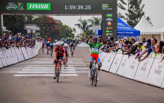 (260302) -- KIGALI, March 2, 2026 -- Henok Mulueberhan (R) of Eritrea celebrates after the 8th stage of the Tour du Rwanda 2026 in Kigali, Rwanda, March 1,2026. (Photo by Xinhua) (SP)RWANDA-KIGALI-CYCLING-TOUR DU RWANDA 2026 CyrilxNdegeya 