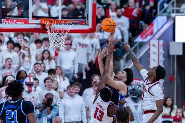 March 2, 2026, Raleigh, North Carolina, USA: Duke Blue Devils forward CAMERON BOOZER (12) goes up for a layup over NC State Wolfpack forward MUSA SAGNIA (13) during the first half of the NCAA, College League, USA ACC menÃ¢â‚¬â ¢s basketball game between the Duke Blue Devils and the NC State Wolfpack at the Lenovo Center in Raleigh, North Carolina. Raleigh USA - ZUMAa220 20260302_znp_a220_036 Copyright: xIsraelxAntax