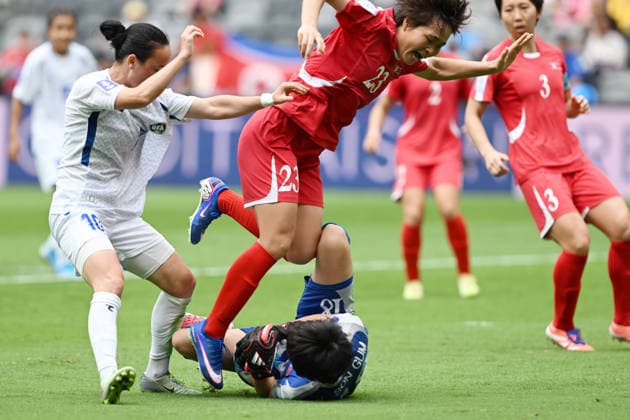 SOCCER ASIAN CUP NORTH KOREA UZBEKISTAN, Goalkeeper Yu Son Gum of North Korea secures the ball as team mate Ri Myong Gum applies pressure to Jonimqulova Maftuna of Uzbekistan during the AFC Women™s Asian Cup Group B match between North Korea and Uzbekistan at CommBank Stadium in Sydney, Tuesday, March 3, 2026. ( NO ARCHIVING, EDITORIAL USE ONLY SYDNEY NEW SOUTH WALES AUSTRALIA  Copyright: xDEANxLEWINSx 20260303111706157959