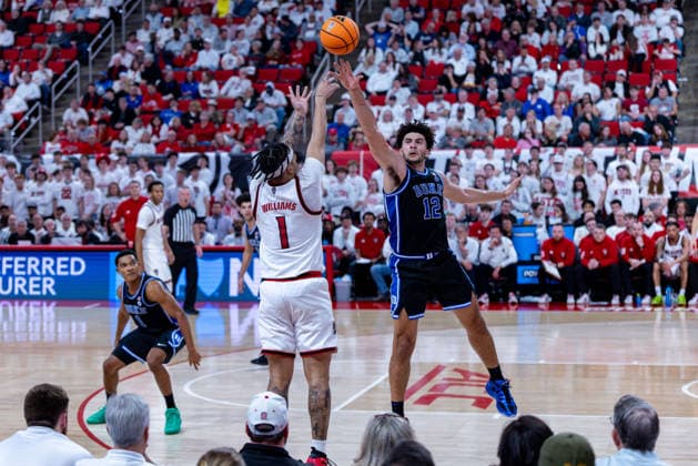 March 2, 2026, Raleigh, North Carolina, USA: NC State Wolfpack forward DARRION WILLIAMS (1) shoots a three pointer over Duke Blue Devils forward CAMERON BOOZER (12) during the second half of the NCAA, College League, USA ACC menÃ¢â‚¬â ¢s basketball game between the Duke Blue Devils and the NC State Wolfpack at the Lenovo Center in Raleigh, North Carolina. Raleigh USA - ZUMAa220 20260302_znp_a220_055 Copyright: xIsraelxAntax