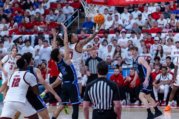 March 2, 2026, Raleigh, North Carolina, USA: NC State Wolfpack guard ALYN BREED (7) drives to the basket and goes up for a layup around Duke Blue Devils guard CAYDEN BOOZER (2) during the second half of the NCAA, College League, USA ACC menÃ¢â‚¬â ¢s basketball game between the Duke Blue Devils and the NC State Wolfpack at the Lenovo Center in Raleigh, North Carolina. Raleigh USA - ZUMAa220 20260302_znp_a220_071 Copyright: xIsraelxAntax