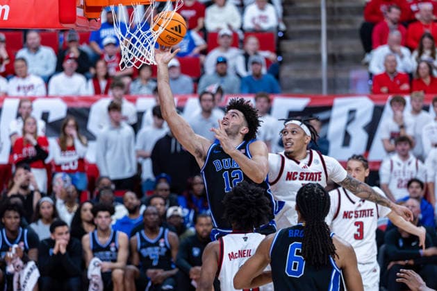 March 2, 2026, Raleigh, North Carolina, USA: Duke Blue Devils forward CAMERON BOOZER (12) drives to the basket and goes up for the layup around NC State Wolfpack forward DARRION WILLIAMS (1) during the second half of the NCAA, College League, USA ACC menÃ¢â‚¬â ¢s basketball game between the Duke Blue Devils and the NC State Wolfpack at the Lenovo Center in Raleigh, North Carolina. Raleigh USA - ZUMAa220 20260302_znp_a220_073 Copyright: xIsraelxAntax