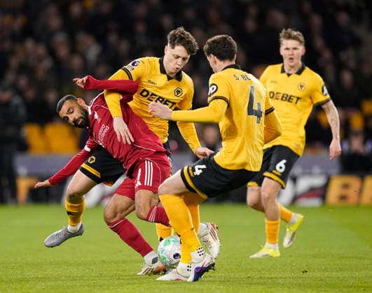 Wolverhampton, England, 3rd March 2026. Mohamed Salah of Liverpool tussles with Ladislav Krejci of Wolverhampton Wanderers during the Wolverhampton Wanderers vs Liverpool Premier League match at Molineux, Wolverhampton. Picture credit should read: Andrew Yates Sportimage EDITORIAL USE ONLY. No use with unauthorised audio, video, data, fixture lists, club league logos or live services. Online in-match use limited to 120 images, no video emulation. No use in betting, games or single club league player publications. SPI_034_AY_Wolves_Liverpool SPI-4574-0031