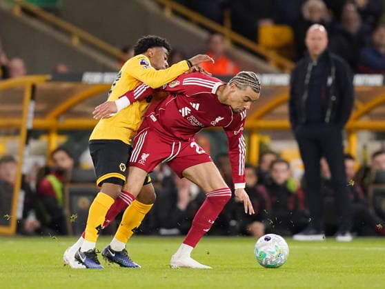 Wolverhampton, England, 3rd March 2026. Angel Gomes of Wolverhampton Wanderers tackles Hugo Ekitike of Liverpool during the Wolverhampton Wanderers vs Liverpool Premier League match at Molineux, Wolverhampton. Picture credit should read: Andrew Yates Sportimage EDITORIAL USE ONLY. No use with unauthorised audio, video, data, fixture lists, club league logos or live services. Online in-match use limited to 120 images, no video emulation. No use in betting, games or single club league player publications. SPI_037_AY_Wolves_Liverpool SPI-4574-0034