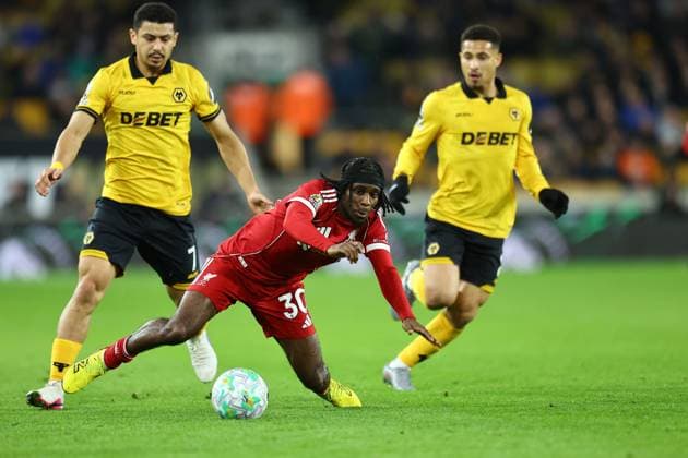 Jeremie Frimpong of Liverpool falls down under pressure from Andre of Wolverhampton Wanderers Wolverhampton Wanderers v Liverpool, Premier League, Football, Molineux, Wolverhampton, UK - 03 Mar 2026Wolverhampton Molineux United Kingdom EDITORIAL USE ONLY No use with unauthorised audio, video, data, fixture lists, club league logos or live services. Online in-match use limited to 120 images, no video emulation. No use in betting, games or single club league player publications. Copyright: xMichaelxZemanek Shutterstockx 16719999ab
